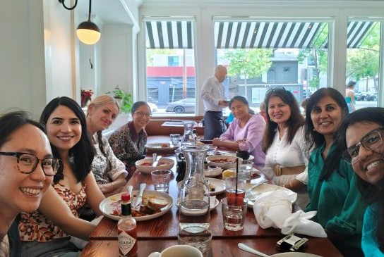 Group gathered around a table at a restaurant for brunch