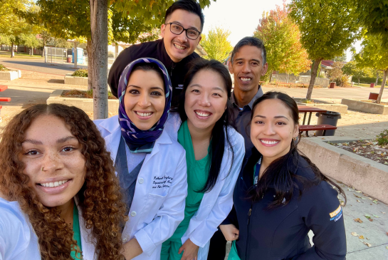 Residents outside for a group selfie photo.