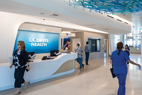 People walking through the 48X Complex outpatient surgery center lobby.