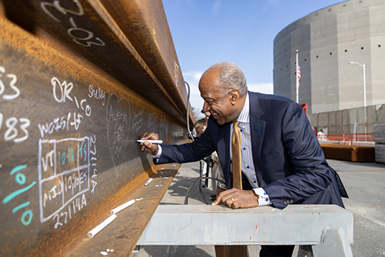 UC Davis Chancellor Gary S. May signing the California Tower beam.