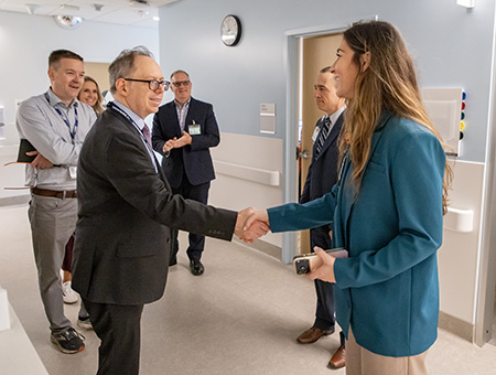 Mark Rosenblatt shaking hands with a colleague at the 48X Complex outpatient surgery center.