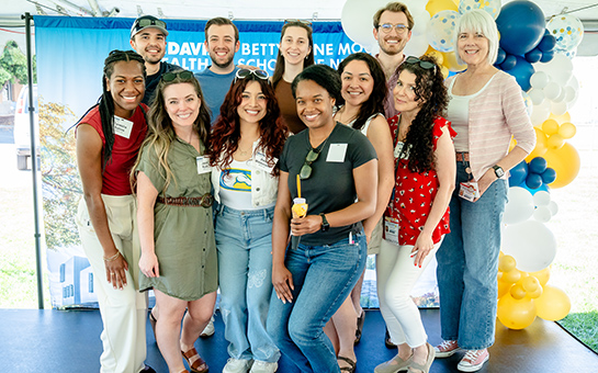 A group shot of school of nursing alumni during a reunion/picnic.