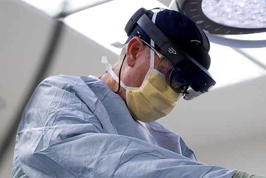 Surgeon with augmented reality goggles