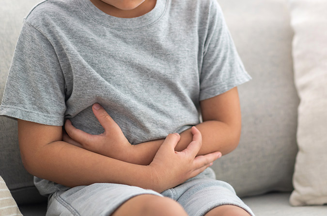 Children holding stomach