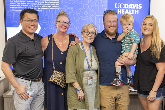 Dr Farmer, Dr Wang, Tobi, and his family