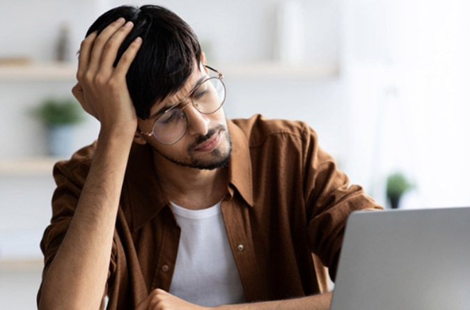 Man holding his forehead
