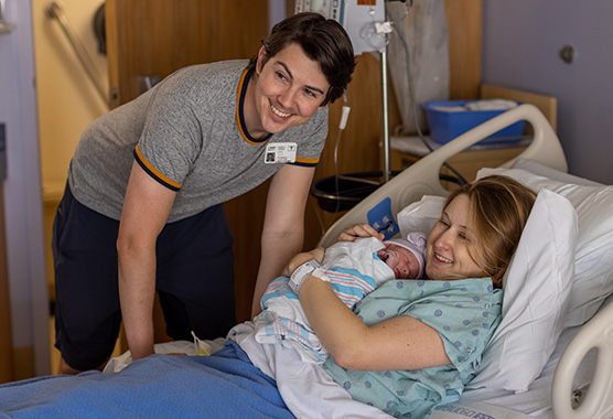 Employee Emily Lillya, her husband Mark and their baby