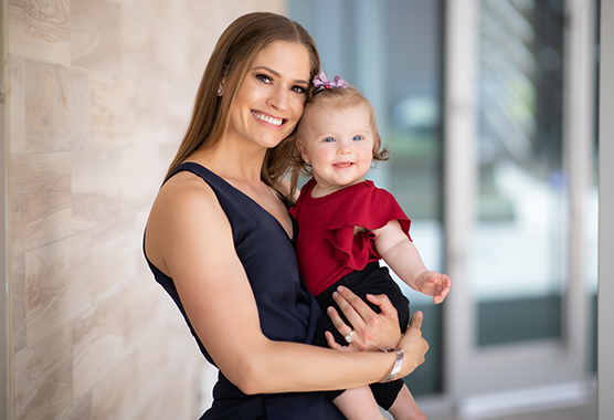 Employee Erin Nella and her daughter