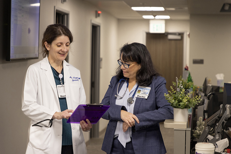 Doctor and fellow in discussion.