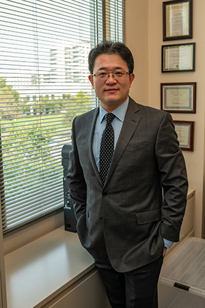 headshot of Professor Aijun Wang