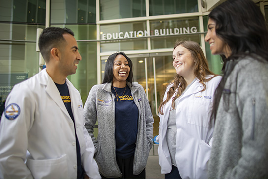 UC Davis medical students in front of the education building