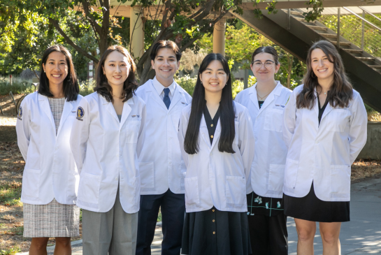 Rural ACE-PC and ACE-PC cohort of students wearing white coats.