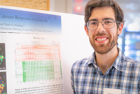 MD/PhD student Mohammad Pourhosseinzadeh on poster day