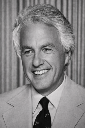Black-and-white studio portrait of Hibbard Williams wearing a light-colored suit and dark tie.