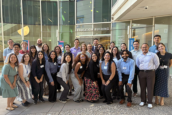 UC Davis Community Health Scholars orientation 2025, an outdoor group photo in front of the education building, Sacramento campus