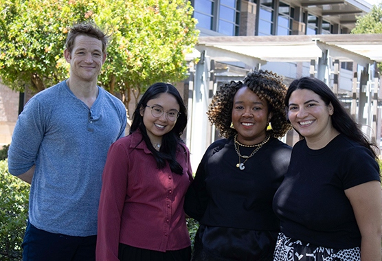 Four doctoral interns outdoors in front of MIND Institute