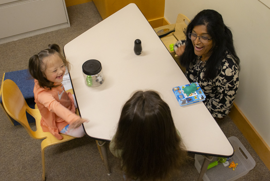researcher working with children