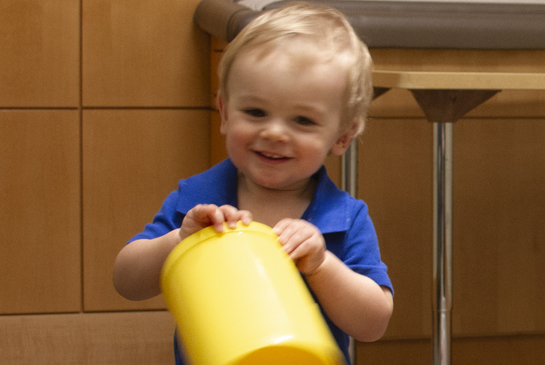 toddler playing in research room