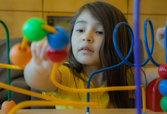 girl playing in the research clinic