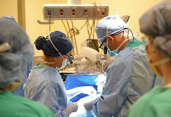 surgeons performing surgery