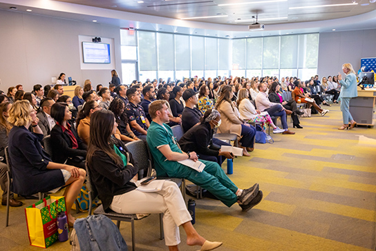 Full room listening to keynote presenter.