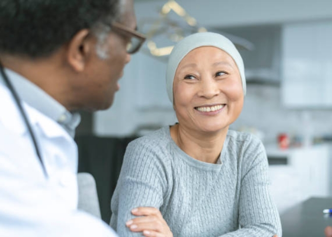 doctor talking with cancer patient