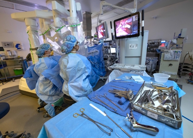 doctor performing robotic surgery