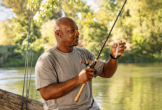 UC Davis Health patient Greg preparing to fish.