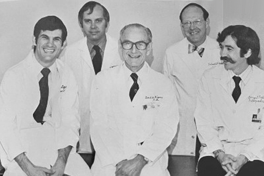 group photo of doctors in a lab coat