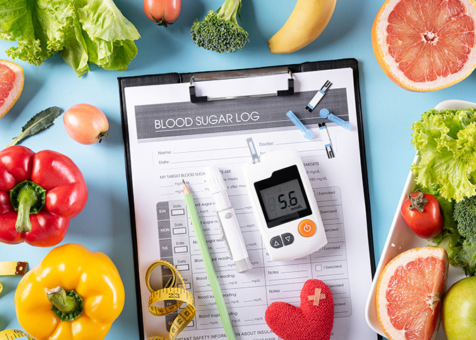 Diabetes blood sugar log and vegetables 