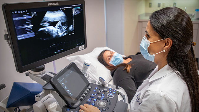 UC Davis doctor performing fetal echocardiogram on pregnant mother
