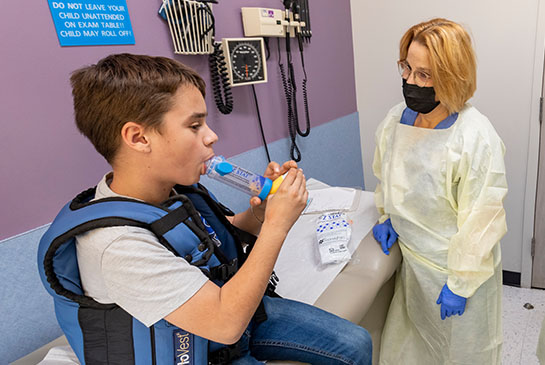 Respiratory specialists performing cystic fibrosis testing for a 
