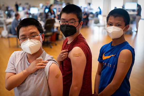 Young boys after getting vaccinated at UC Davis