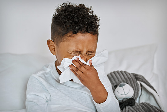 pediatric allergies, young boy sneezing