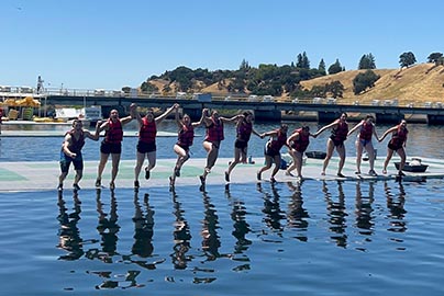 Eleven residents enjoy one of Sacramento's lakes, jumping in at the same time while holding hands.