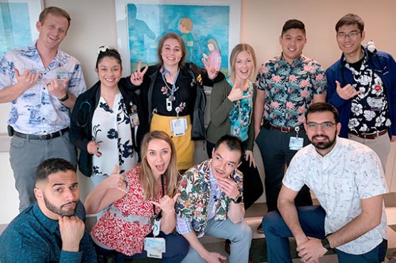 Residents dress up for Hawaiian shirt day and pose for photo.