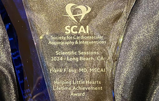 Chief of Pediatrics recieves lifetime award, glass engraved award