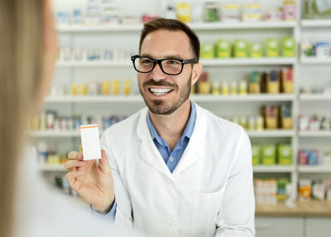 pharmacist explains prescription to patients