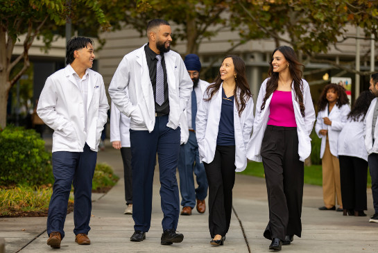A group of students talking on campus