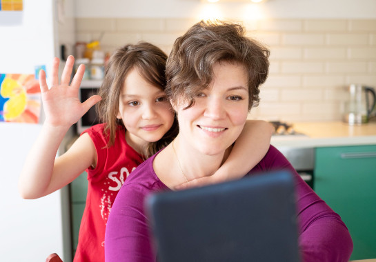 A girl and her mom on a virtual appointment