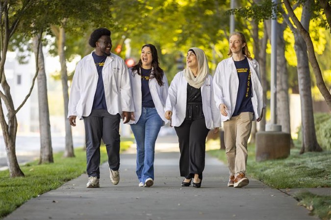Group of medical students walking and smiling 