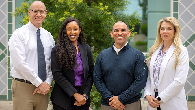 Physician Referral Liaison group photo outdoors, 4 team members