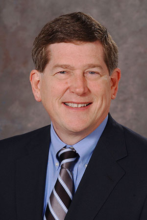 Mark E. Servis