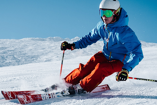 A skier coming down a slope.