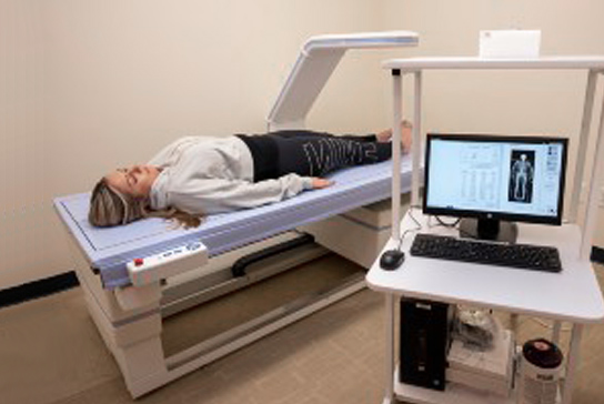 A women lying on a body scanner table and the resulting images.