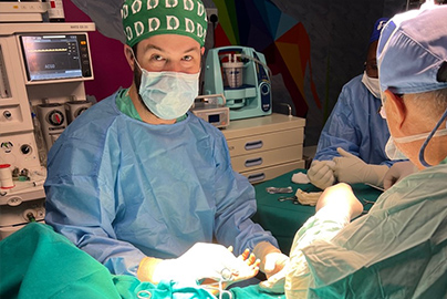 Doctor Powelson assisting Doctor Goran during an operation to correct severe hand contractures of a child’s hand.
