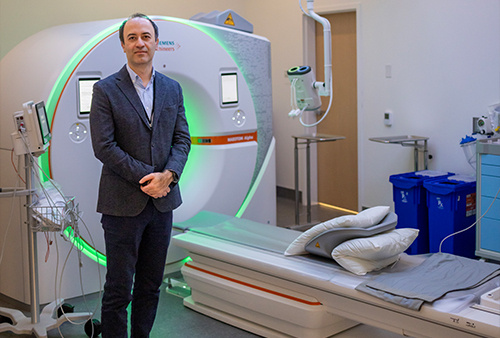 Cardiothoracic Imaging Chief Ahmadreza  Ghasemiesfe with the new photon-counting CT scanner at UC Davis Health&rsquo;s 48X Complex.