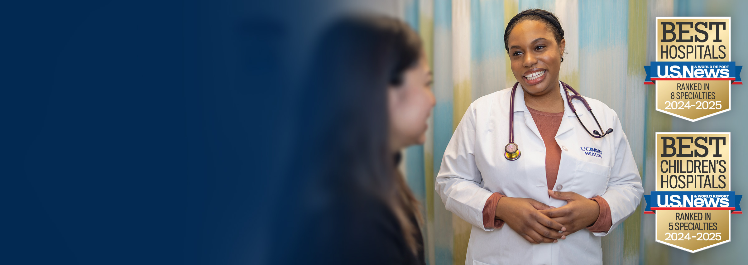 UC Davis Health female provider smiling at patient in clinic