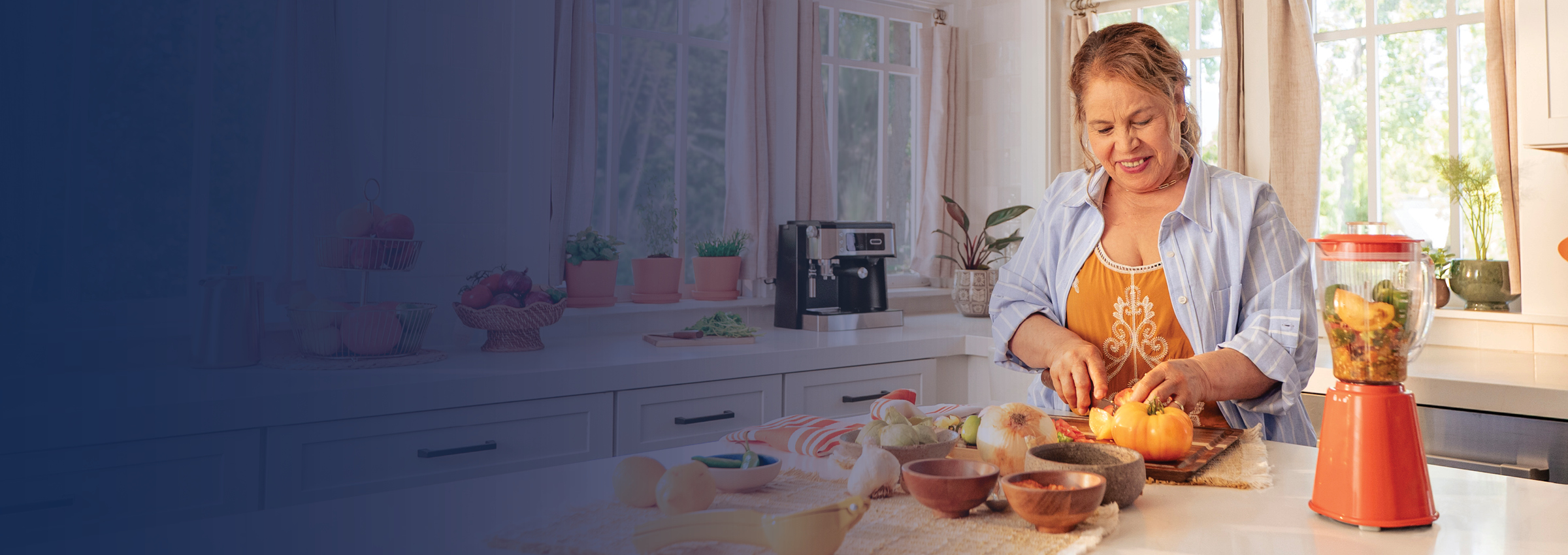 Woman cutting food and blending it in her kitchen