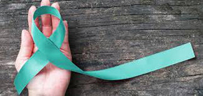 This graphic shows a hand holding a teal ribbon symbolizing cervical cancer awareness